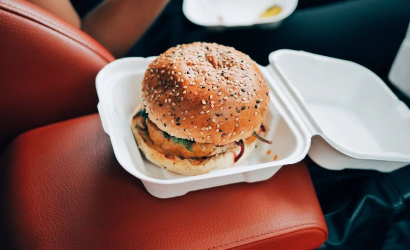 Take out burger in a car